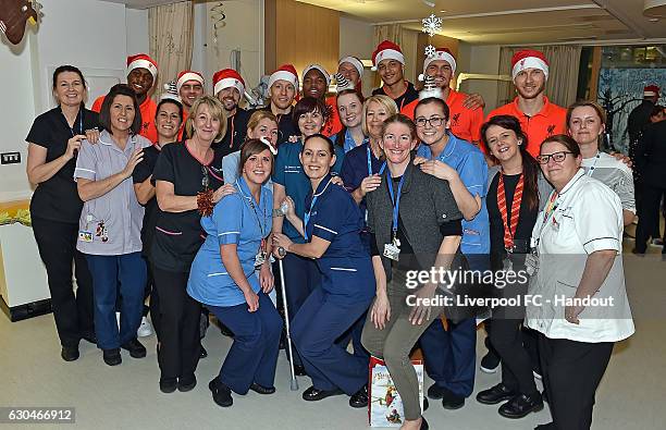Liverpool players pose with hospital staff at Alder Hey Children's Hospital on December 23, 2016 in Liverpool, England.