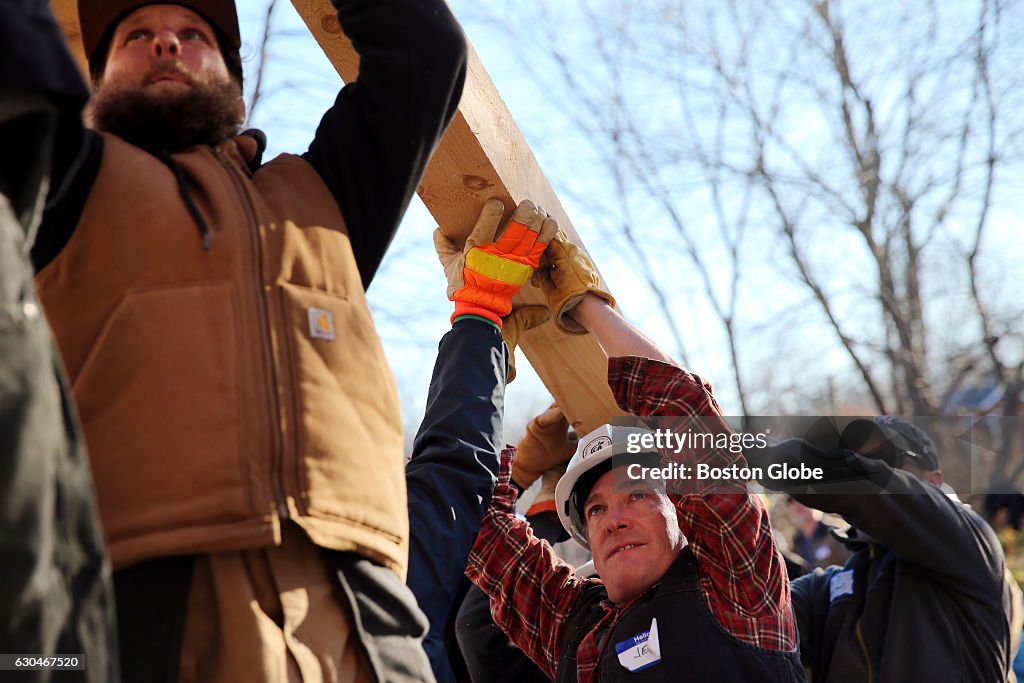 Volunteers raise a barn, and spirits, at Concord farm