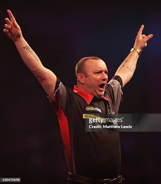 Darren Webster of Great Britain celebrates his win against Simon Whitlock of Australia during day nine of the 2017 William Hill PDC World Darts...