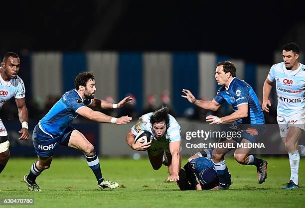 Racing's French centre Henry Chavancy falls after a tackle during the French Top 14 rugby union match between Racing 92 and Castres Olympique at the...