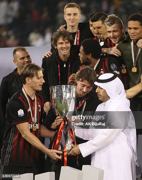 Prime Minister of Qatar, Abdullah bin Nasser bin Khalifa Al Thani presenting the trophy to Ignazio Abate , Caption of AC Milan after winning the...