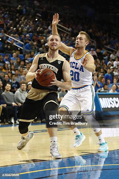 Tucker Haymond of the Western Michigan Broncos handles the ball against Bryce Alford of the UCLA Bruins during their game at Pauley Pavilion on...