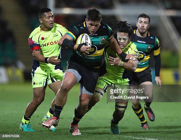 Ethan Waller of Northampton holds off TJ Ioane during the Aviva Premiership match between Northampton Saints and Sale Sharks at Franklin's Gardens on...
