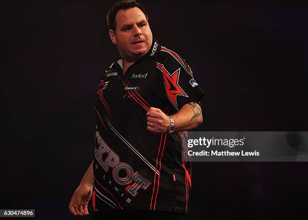 Adrian Lewis of Great Britain celebrates winning the first set against Joe Cullen of Great Britain during day nine of the 2017 William Hill PDC World...