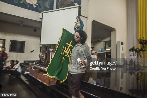 Man preparing for Christmas in Church Saint Antonius, Yogyakarta, Indonesia on December 23, 2016. This activities preparation Christmas in Yogyakarta.