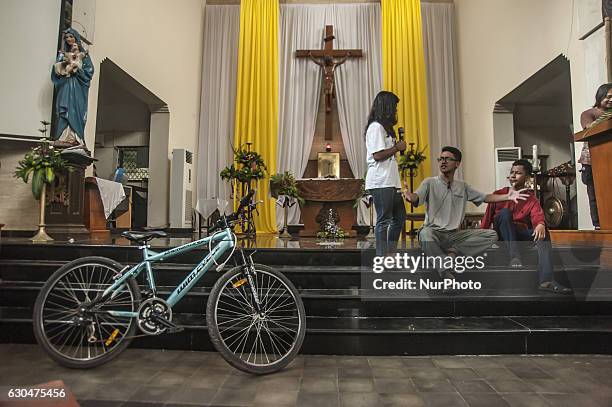 Some children preparing for Christmas in Church Saint Antonius, Yogyakarta, Indonesia on December 23, 2016. This activities preparation Christmas in...