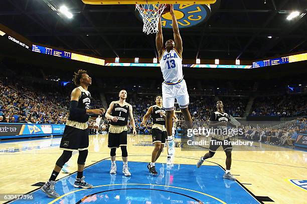 Ike Anigbogu of the UCLA Bruins dunks the ball during the first half against the Western Michigan Broncos at Pauley Pavilion on December 21, 2016 in...