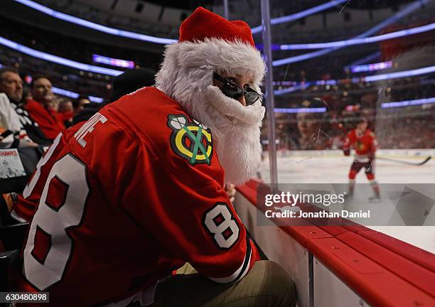 Matt Baloun of Barrington, Illinois, watches as the Chicago Blackhawks take on the Colorado Avalanche at the United Center on December 23, 2016 in...