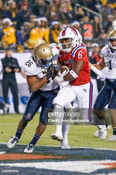 Louisiana Tech Bulldogs running back Boston Scott scores a rushing touchdown during the Armed Forces Bowl between the Navy Midshipmen and Louisiana...