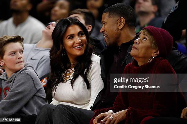 Molly Qerim and Jalen Rose of ESPN watch the Golden State Warriors play the Golden State Warriors at the Palace of Auburn Hills on December 23, 2016...