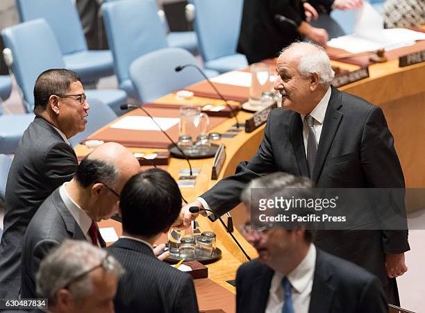 Palestinian Permanent Observer to the UN Riyad Mansour greets Malaysian Ambassador to the UN Dato' Ramlan Ibrahim before the start of the meeting....