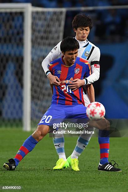 Shogo Taniguchi of Kawasaki Frontale and Ryoichi Maeda of FC Tokyo compete for the ball during the 96th Emperor's Cup quarter final match between FC...