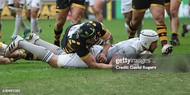 Dave Attwood of Bath dives over for their second try during the Aviva Premiership match between Wasps and Bath Rugby at The Ricoh Arena on December...