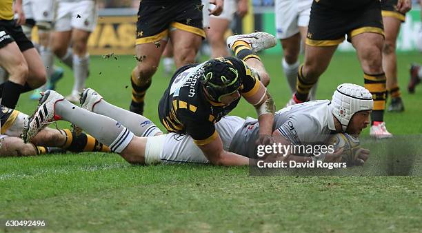 Dave Attwood of Bath dives over for their second try during the Aviva Premiership match between Wasps and Bath Rugby at The Ricoh Arena on December...