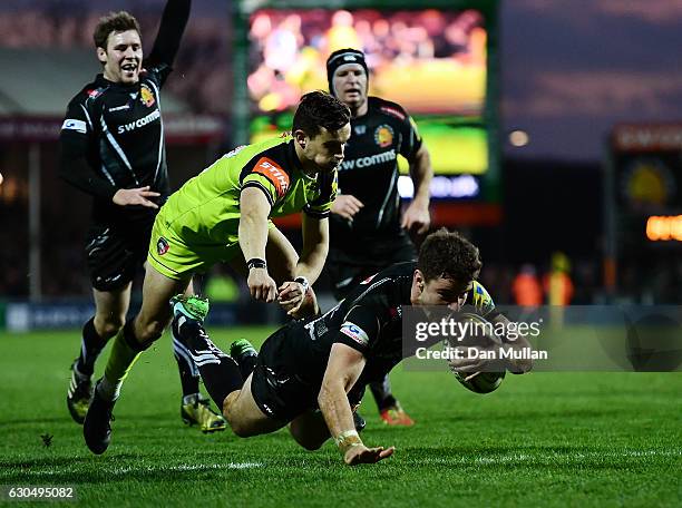 Ollie Devoto of Exeter Chiefs dives over to score his side's fourth try during the Aviva Premiership match between Exeter Chiefs and Leicester Tigers...