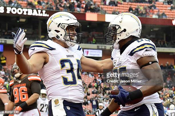 Antonio Gates of the San Diego Chargers celebrates with Derek Watt after catching a 1 yard touchdown pass in the first quarter against the Cleveland...