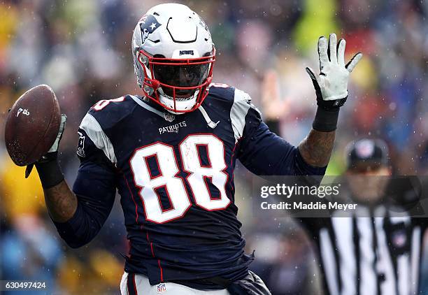 Martellus Bennett of the New England Patriots celebrates after scoring a touchdown against the New York Jets during the first half at Gillette...