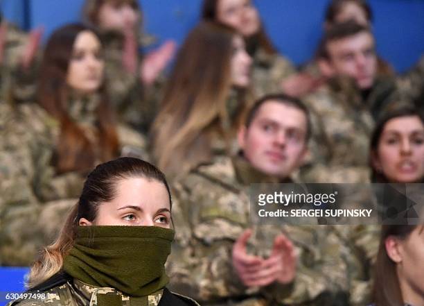 Ukrainian servicemen react during the final competition in the CrossFit Games "Games of the Heroes" in Kiev on December 24, 2016. Some fifteen...
