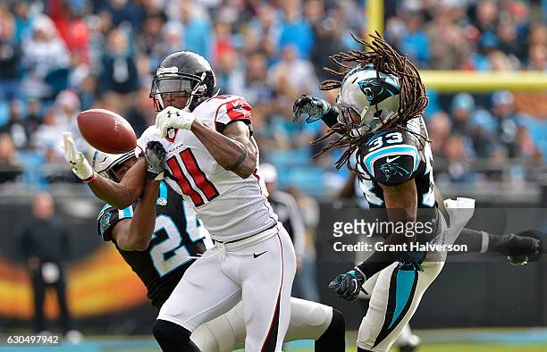 Tre Boston and teammate James Bradberry of the Carolina Panthers defend a pass to Julio Jones of the Atlanta Falcons in the 1st quarter during the...