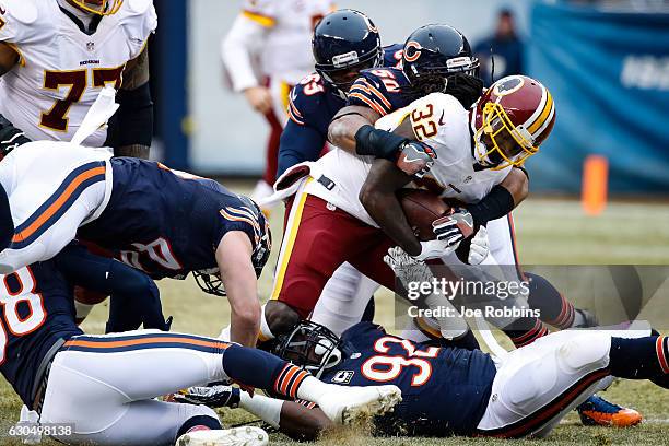 Rob Kelley of the Washington Redskins is tackled by Jerrell Freeman of the Chicago Bears in the first quarter at Soldier Field on December 24, 2016...