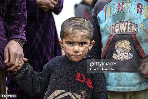 Syrian people evacuated from eastern Aleppo due to Assad regime and its supporter foreign terrorists attacks on civilians, live under winter...