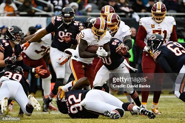 Rob Kelley of the Washington Redskins carries the football against Jerrell Freeman of the Chicago Bears in the first quarter at Soldier Field on...