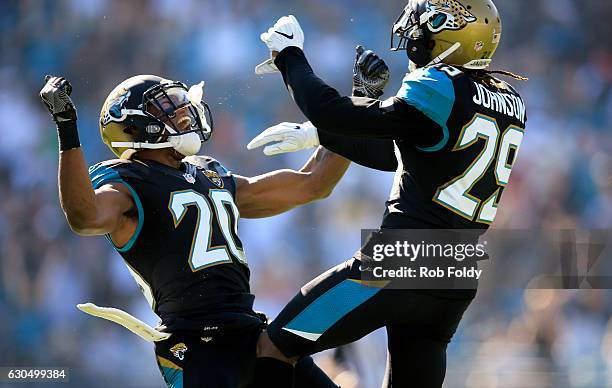 Jalen Ramsey of the Jacksonville Jaguars celebrates with teammate Josh Johnson after a defensive stop during the first half of the game against the...