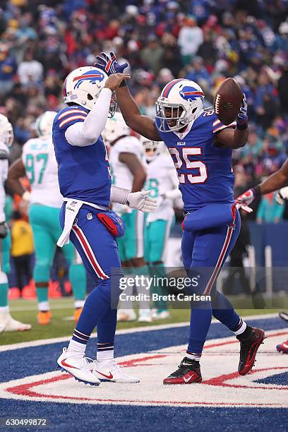LeSean McCoy of the Buffalo Bills celebrates his touchdown with Tyrod Taylor of the Buffalo Bills against the Miami Dolphins during the second half...