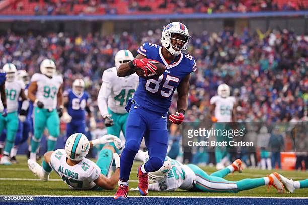 Charles Clay of the Buffalo Bills scores a touchdown during the second half at New Era Stadium on December 24, 2016 in Orchard Park, New York.