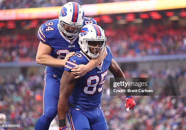 Charles Clay of the Buffalo Bills celebrate his touchdown with Nick O'Leary of the Buffalo Bills against the Miami Dolphins during the second half at...