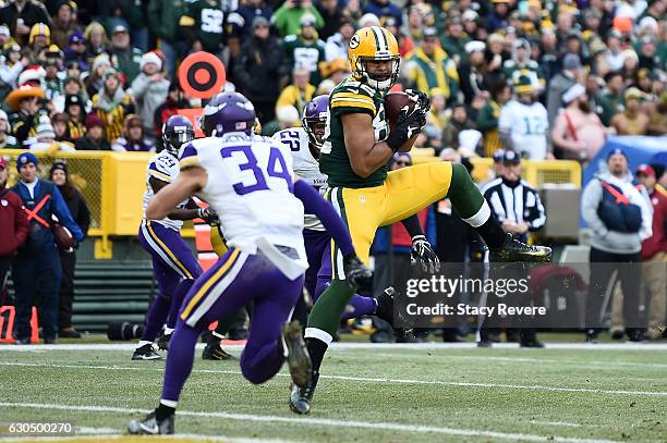 Richard Rodgers of the Green Bay Packers catches a pass for a touchdown during the second half of a game against the Minnesota Vikings at Lambeau...