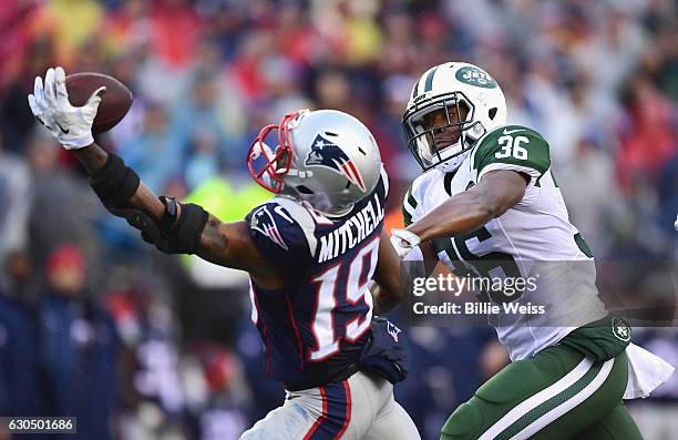 Malcolm Mitchell of the New England Patriots attempts to catch a pass as he is defended by Doug Middleton of the New York Jets during the second...