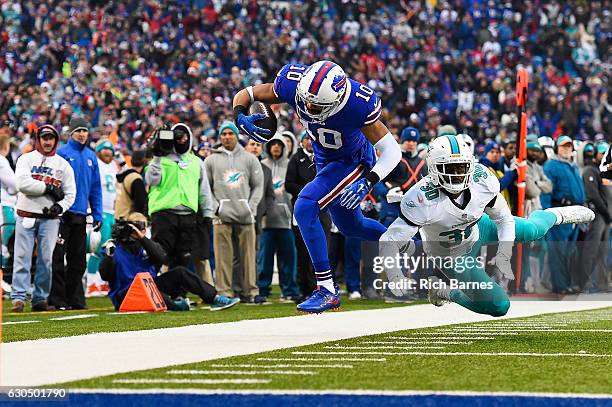 Robert Woods of the Buffalo Bills makes a catch in front of Bacarri Rambo of the Miami Dolphins during the second half at New Era Stadium on December...