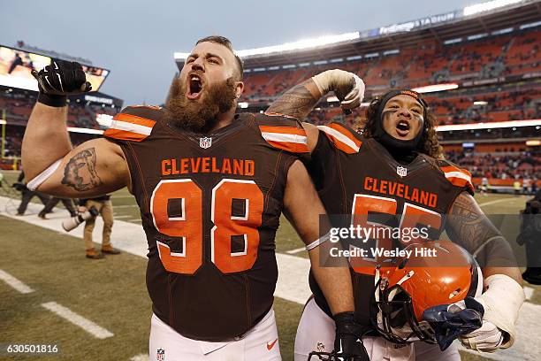 Jamie Meder and Danny Shelton of the Cleveland Browns celebrate after defeating the San Diego Chargers 20-17 at FirstEnergy Stadium on December 24,...