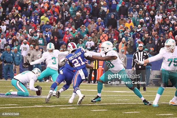 Andrew Franks of the Miami Dolphins kicks the game tying field goal against the Buffalo Bills in overtime at New Era Stadium on December 24, 2016 in...