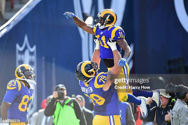 Tavon Austin celebrates with Robert Havenstein of the Los Angeles Rams after scoring a touchdown during the first quarter against the San Francisco...