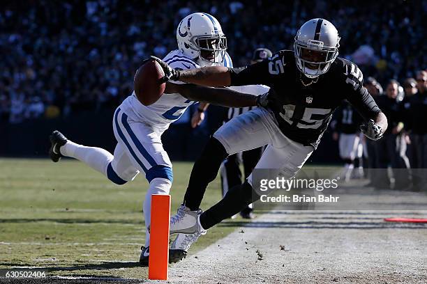 Michael Crabtree of the Oakland Raiders dives short of the goal line during their NFL game against the Indianapolis Colts at Oakland Alameda Coliseum...