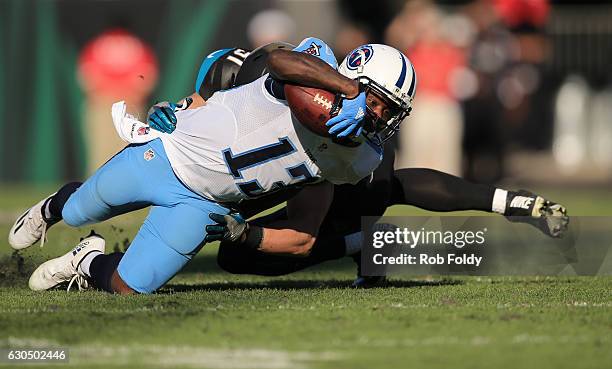 Kendall Wright of the Tennessee Titans reaches for additional yardage during the second half of the game against the Jacksonville Jaguars at EverBank...