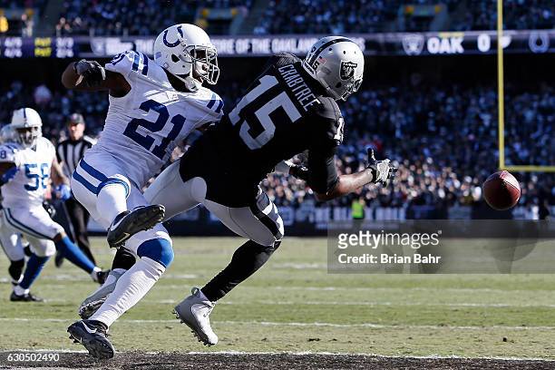Michael Crabtree of the Oakland Raiders is unable to make a catch in the end zone as Vontae Davis of the Indianapolis Colts defends during their NFL...