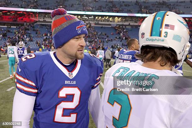 Dan Carpenter of the Buffalo Bills talks to Andrew Franks of the Miami Dolphins after the game at New Era Stadium on December 24, 2016 in Orchard...