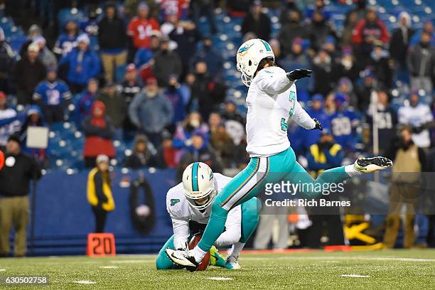 Andrew Franks of the Miami Dolphins kicks the game winning field goal against the Buffalo Bills in overtime at New Era Stadium on December 24, 2016...
