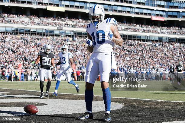 Donte Moncrief of the Indianapolis Colts celebrates after a 24-yard touchdown catch against the Oakland Raiders during their NFL game at Oakland...