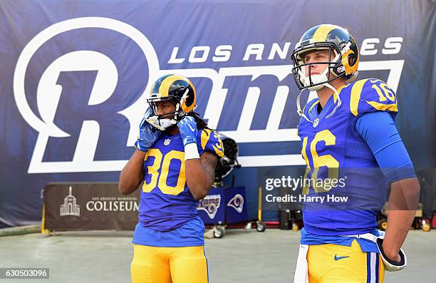 Todd Gurley and Jared Goff of the Los Angeles Rams look on before the game against the San Francisco 49ers at Los Angeles Memorial Coliseum on...