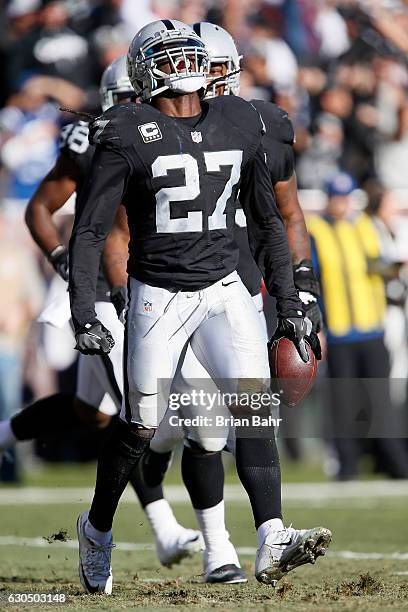 Reggie Nelson of the Oakland Raiders celebrates after intercepting a pass intended for T.Y. Hilton of the Indianapolis Colts in the endzone during...