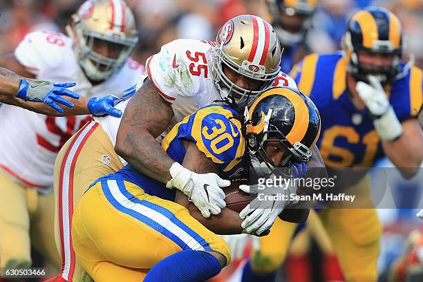 Ahmad Brooks of the San Francisco 49ers tackles Todd Gurley of the Los Angeles Rams during the first half of their game at Los Angeles Memorial...
