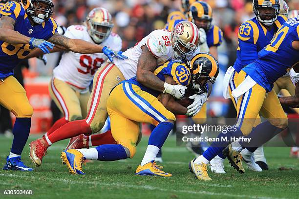 Ahmad Brooks of the San Francisco 49ers tackles Todd Gurley of the Los Angeles Rams during the first half of their game at Los Angeles Memorial...