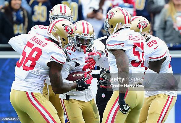 Tramaine Brock of the San Francisco 49ers celebrates with teammates after intercepting Jared Goff of the Los Angeles Rams during the first quarter of...