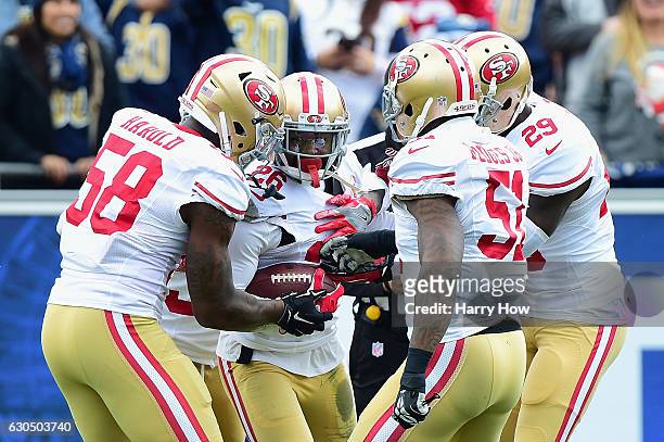 Tramaine Brock of the San Francisco 49ers celebrates with teammates after intercepting Jared Goff of the Los Angeles Rams during the first quarter of...