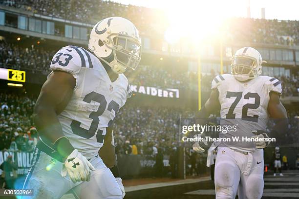 Robert Turbin of the Indianapolis Colts celebrates after scoring against the Oakland Raiders during their NFL game at Oakland Alameda Coliseum on...