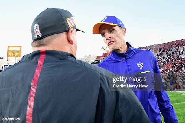 Head coach Chip Kelly of the San Francisco 49ers greets interim head coach John Fassel of the Los Angeles Rams after the 49ers defeated the Rams...